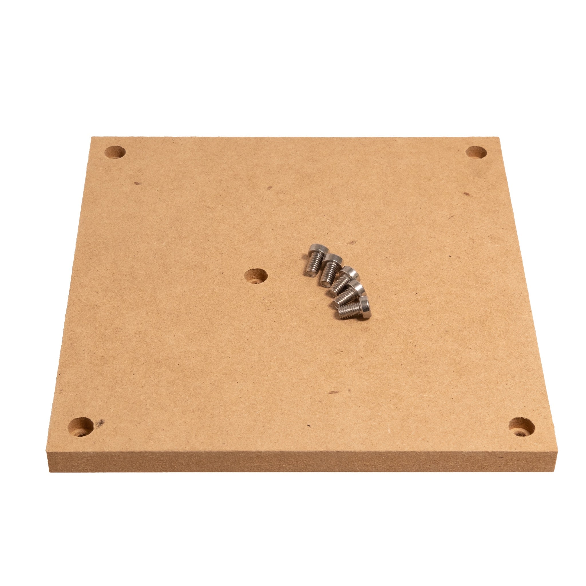 Figure 7 — An MDF wasteboard of the type fitted beneath the cutter. It provides a flat reference and a sacrificial surface, and carries the clamping features that hold work down. Source: Carbide 3D…